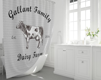 May include: A gray and white shower curtain with a black and white illustration of a cow and the text "Gallant Family Dairy Farm Est. 2006".