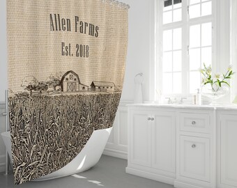 May include: A brown and beige shower curtain with a burlap texture. The curtain features a sketch of a farm with a barn and fields of wheat. The text "Allen Farms Est. 2018" is printed on the top of the curtain.