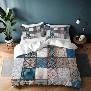 May include: A white duvet cover with a patchwork design featuring blue, brown, and white tiles. The duvet cover has a geometric pattern and is made of soft, comfortable fabric.