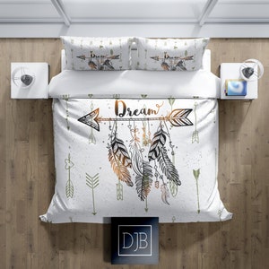 May include: White duvet cover with a green and brown arrow with the word "Dream" on it. The arrow has feathers hanging from it. The duvet cover has a pattern of green arrows on it.