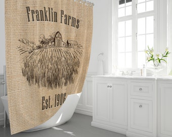 May include: A brown burlap shower curtain with a black and white sketch of a farm scene. The text "Franklin Farms Est. 1906" is printed on the curtain.