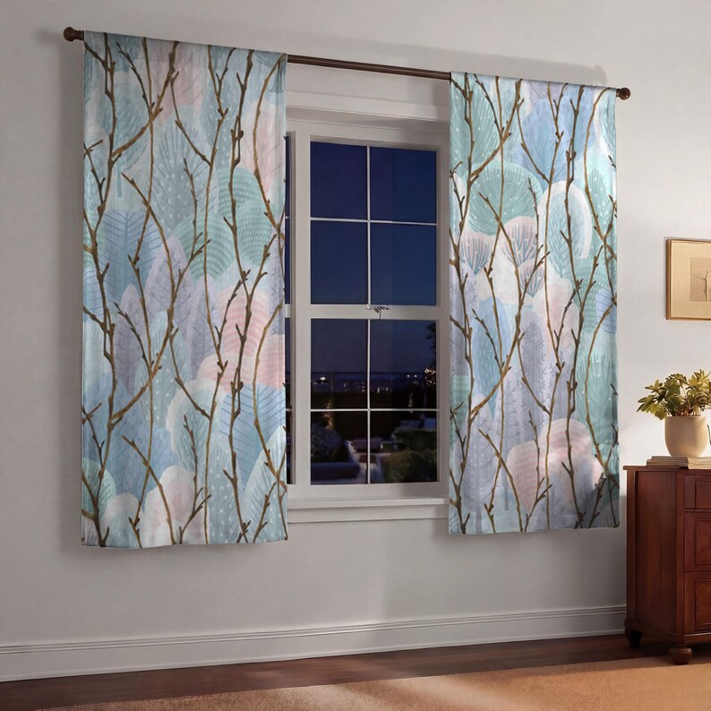 a window with a view of a city skyline, and the curtains have a leafy, tree-like pattern in shades of blue, green, and white.