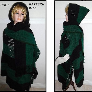 May include: A handmade crochet hooded poncho in black and forest green. The poncho features a striped design, fringe detailing, and a hood. The text "CROCHET PATTERN #755" is visible in the image. This item is a cozy and stylish accessory.