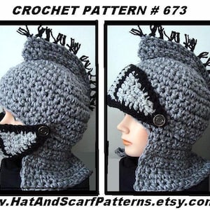 May include: Crochet pattern #673 for a knight's helmet. The helmet is gray with black trim and a black mohawk. The design includes a face guard and a neck protector. The website address www.HatAndScarfPatterns.etsy.com is at the bottom.