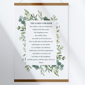 Op de afbeelding: Een printbaar wanddecor ontwerp met het Onze Vader omringd door aquarel groen. De tekst is in een eenvoudig zwart lettertype.