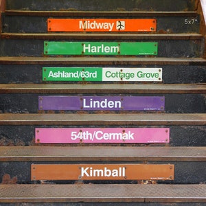 May include: A set of six rusty metal steps with signs indicating different Chicago 'L' train stops. The signs are in various colors, including orange, green, white, purple, pink, and brown. The signs read: Midway, Harlem, Ashland/63rd Cottage Grove, Linden, 54th/Cermak, and Kimball.