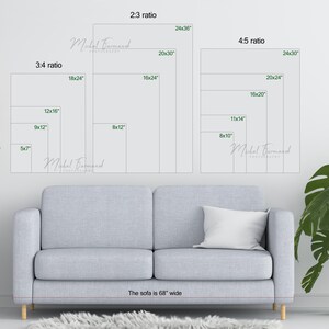 May include: A white sofa with a 68-inch width, positioned in front of a white wall with various sizes of framed artwork displayed. The artwork is labeled with different aspect ratios and dimensions in inches.