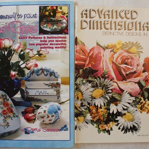 May include: Two books on painting techniques. The book on the left is titled "Teach Yourself to Paint Ribbons & Roses" and features a floral motif. The book on the right is titled "Advanced Dimensionale: Distinctive Designs in Relief" and features a bouquet of roses and daisies.