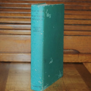 May include: A teal-colored book titled "Text-Book of Practical Physics" by Allen and Moore. The book is published by Macmillan.