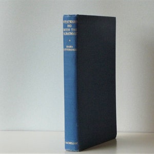 May include: A blue hardcover book with the title "Westward Ho with the Albatross" by Hans  Butterworth. The book is published by Macmillan.