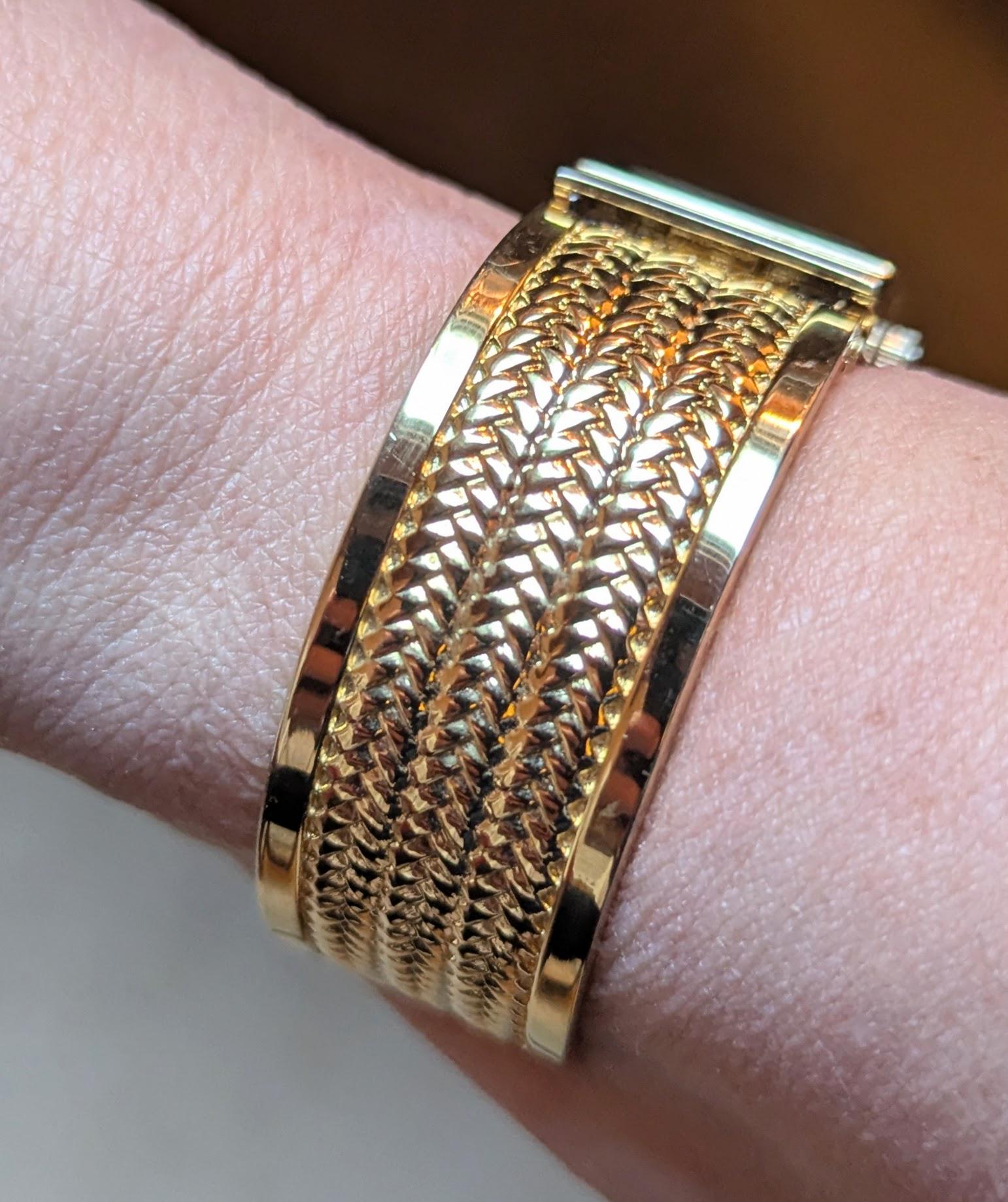 Gold-Tone Cuff Bracelet Watch
1141 Vintage Gold Tone Cuff Watch Bracelet: Braided Rope Detail  main image 2