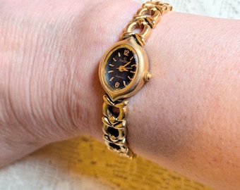 Working Vintage Elgin Gold Tone Oval Watch with Blue Dial and Faceted Crystal