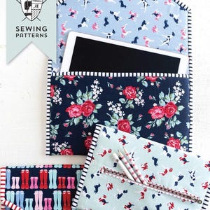 May include: A collection of fabric cases with various patterns. One case features a blue background with dog illustrations, another has a navy floral design, and a third showcases rain boots. The cases are trimmed with striped fabric and include the text "Sewing Patterns".
