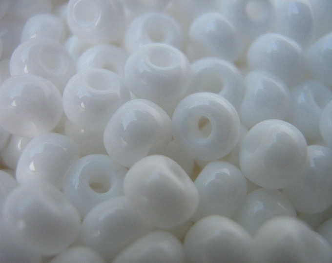 6/0 Round Czech seed beads in the color opaque White.