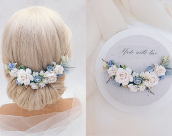 Bridal headpiece with blue and white flowers, dried Baby's breath, preserved stoebe and delicate butterfly wings. Romantic wedding hair vine