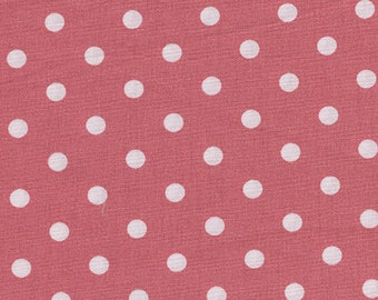 Printed cotton fabric with white polka dots on dark pink background