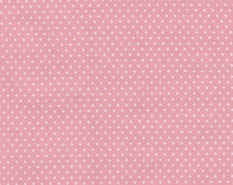 Mini white dots cotton fabric on a pink background