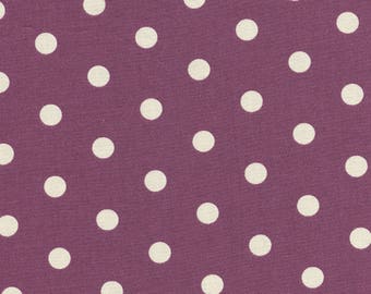 Cotton fabric printed with white polka dots on burgundy background