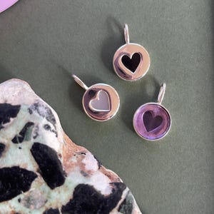 “Love” medals in 925 silver and fine stones.