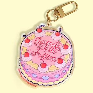 The Original “Congrats on the Autism” Autism Keychain Diagnosis or Discovery Celebration Acrylic & Resin Pink Cake Neurodiversity Pride gift