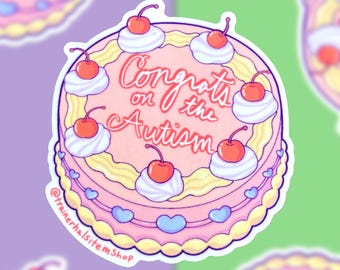 Könnte beinhalten: Ein Aufkleber mit einem rosa Kuchen mit weißer Sahne, Kirschen und dem Text "Congrats on the Autism". Der Kuchen hat einen gelben und rosa Rand mit blauen Herzakzenten. Der Aufkleber hat einen weißen Rand und einen lila, grünen und weißen Hintergrund.