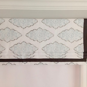 Faux (fake) flat roman shades, valance, with grosgrain ribbon.  The perfect solution.  Monroe Snowy With Brown Ribbon.