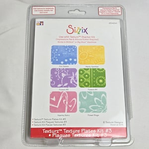 May include: Sizzix Texturz Starter Kit with six texture designs. The kit includes plates with patterns such as Dot Daisies, Wacky Sparkles, Flowers #3, Flowers #4, Hearts Retro, and Flower Rings. The kit is designed for use with BigKick or Big Shot machines.