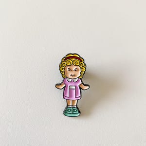 Polly pocket enamel pin