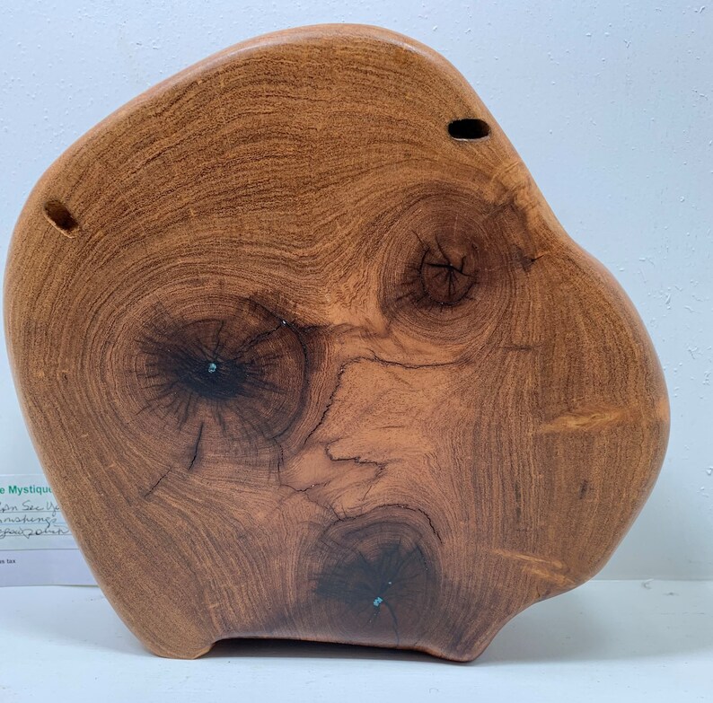 Art piece which is so whimsical handcrafted mesquite wood named I Can See Your Face