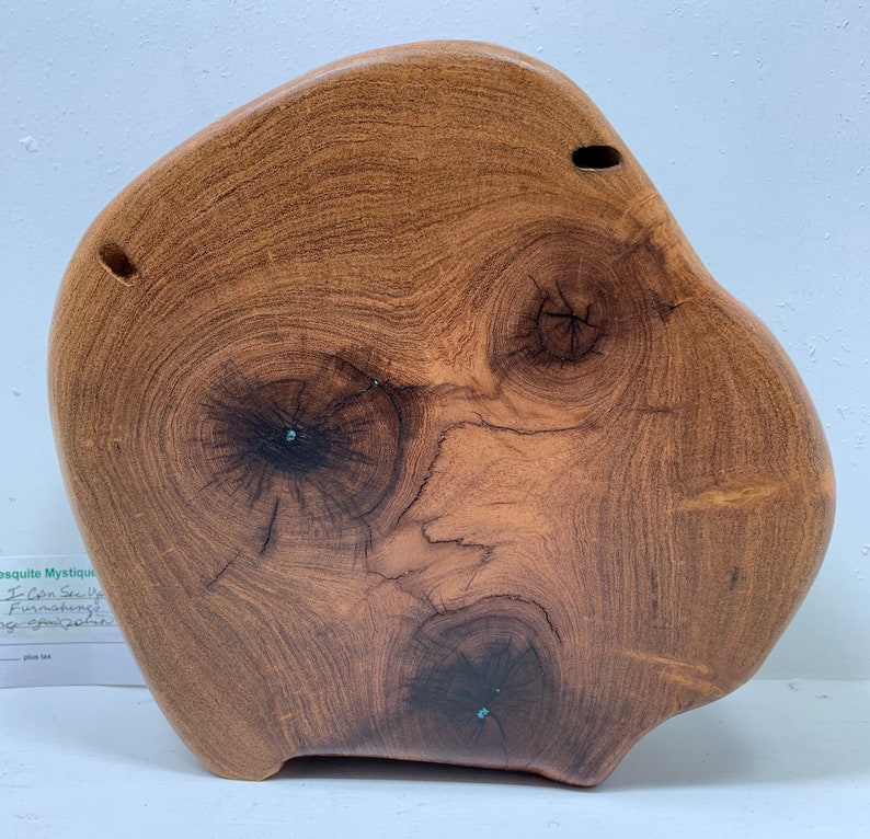 Art piece which is so whimsical handcrafted mesquite wood named I Can See Your Face
