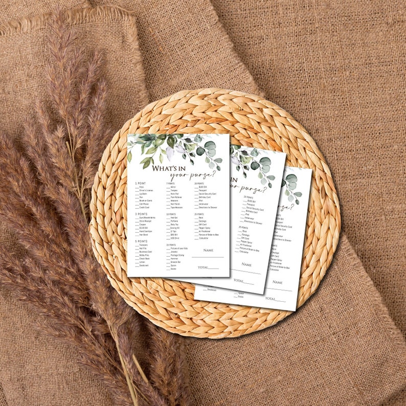 May include: Three printable game cards with a green and white floral design. The cards have the title "What's in your purse?" and a list of items to check off.