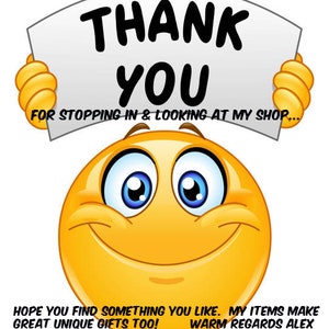 May include: A yellow smiley face emoticon holding a white sign that says "THANK YOU FOR STOPPING IN & LOOKING AT MY SHOP... HOPE YOU FIND SOMETHING YOU LIKE. MY ITEMS MAKE GREAT UNIQUE GIFTS TOO! WARM REGARDS ALEX"