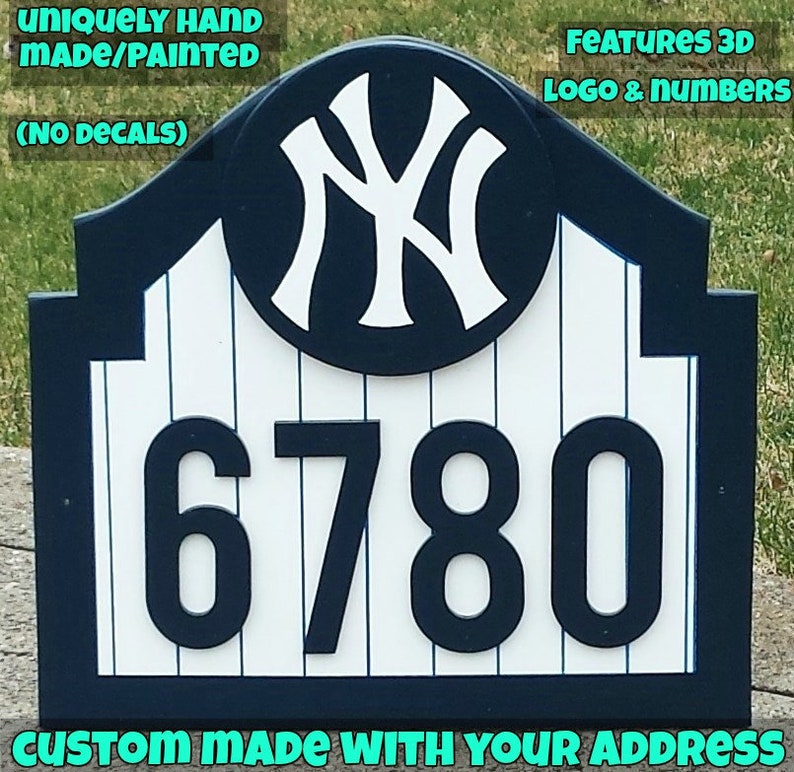 May include: A custom-made house number sign featuring a blue and white baseball team logo and the number 6780. The sign is crafted from wood and has a white picket fence design. The sign is hand-painted and boasts 3D lettering.