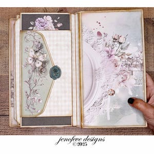 May include: An open scrapbook with floral and butterfly designs. The left side features a light green envelope with a wax seal and a floral design. The right side has a white frame with floral accents. The text "jenefeve designs &copy;2025" is visible.