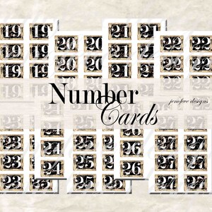 May include: A set of black and gold number cards with a white background. The numbers range from 19 to 27. The cards are arranged in rows and columns. The text "Number Cards" is written in black on a white background.