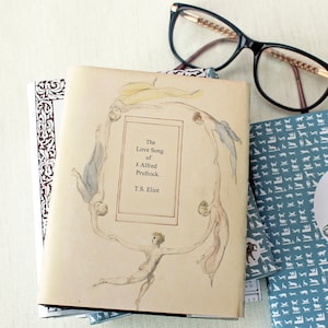 A collection of handmade books that shows the tribute to T. S . Eliot's poem Prufrock. This handmade artist book is printed onto watercolour paper and features illustration to complement the poem. Hand stitched and presented in a slip cover.