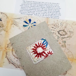 Cover of the handmade tribute to the Voynich manuscript with a pull out map and explanatory page of the  ancient treasure.