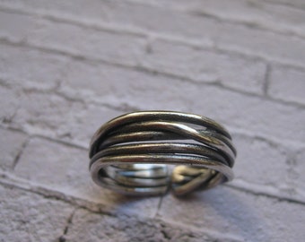 Handmade adjustable sterling silver oxidized ring.