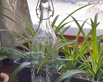 Swing top 32 ounce Glass Bottle. Sand etched