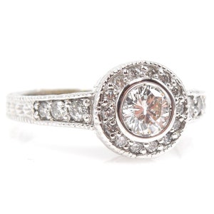 Half Carat Diamond Halo Engagement Ring in 18K White Gold