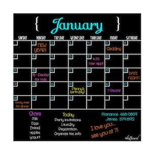 May include: A black chalkboard with a January calendar. The calendar has handwritten notes for each day, including "New Year!" on January 1st, "Penny's birthday!" on January 24th, and "Date Night!" on January 20th. There are also notes for "Store" and "Today" with lists of items and tasks.
