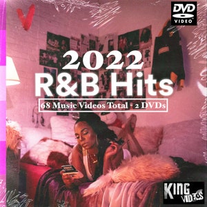May include: DVD case for "2022 R&B Hits" with a woman on a bed, surrounded by pink and red decor. The DVD case has the text "2022 R&B Hits" and "68 Music Videos Total - 2 DVDs". The DVD case has a "DVD VIDEO" logo.
