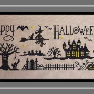 May include: A black and white cross-stitch pattern featuring a spooky Halloween scene with a witch flying on a broomstick, a haunted house, a ghost, a tree, and pumpkins. The text "Happy Halloween Night" is stitched in black.