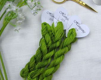 359 Hangang hand dyed variegated stranded cotton skein in bright green tones.