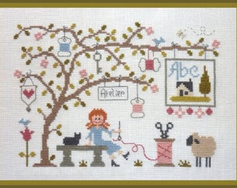 Lili Stitching in the Garden – counted cross stitch chart. Flowers, sheep, cat, garden motifs.