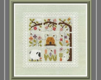 Colours in my Garden counted cross stitch chart to work in 11 colours of DMC thread. 9 square motifs with a lace style border.