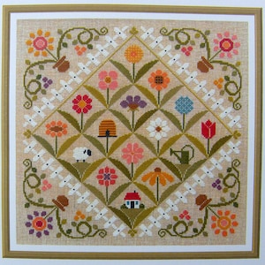 Diagrama de punto de cruz contado Flower Show para trabajar en 15 colores de hilo DMC.