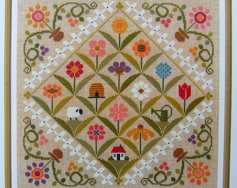 Flower Show counted cross stitch chart to work in 15 colours of DMC thread.