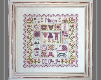 Patchwork Baby – counted cross stitch chart to work in 8 colours of DMC thread. Pink and Blue Traditional style patchwork houses and motifs.