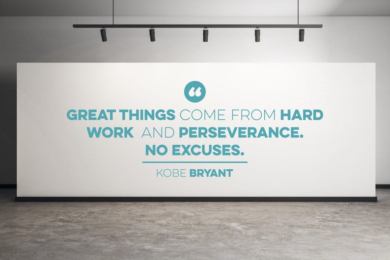 May include: A white wall with a motivational quote in blue text: "Great things come from hard work and perseverance. No excuses." The quote is attributed to Kobe Bryant.